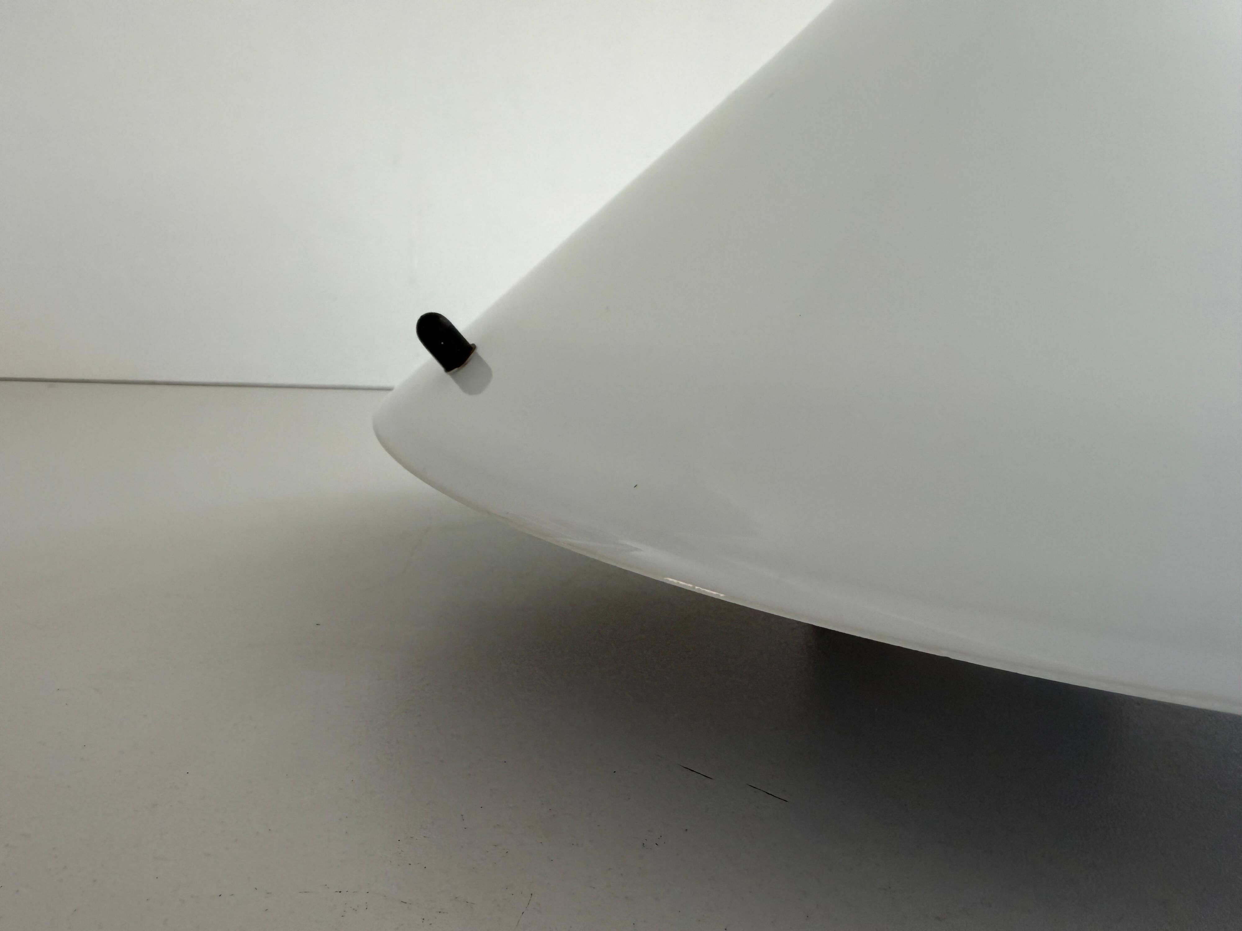Simple opal glass wall light from the mid-century by Lamperti, 1960s, Italy.