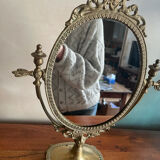 Swivelling brass mirror