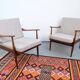 Vintage teak lounge chair, retro 1960s–70s style.