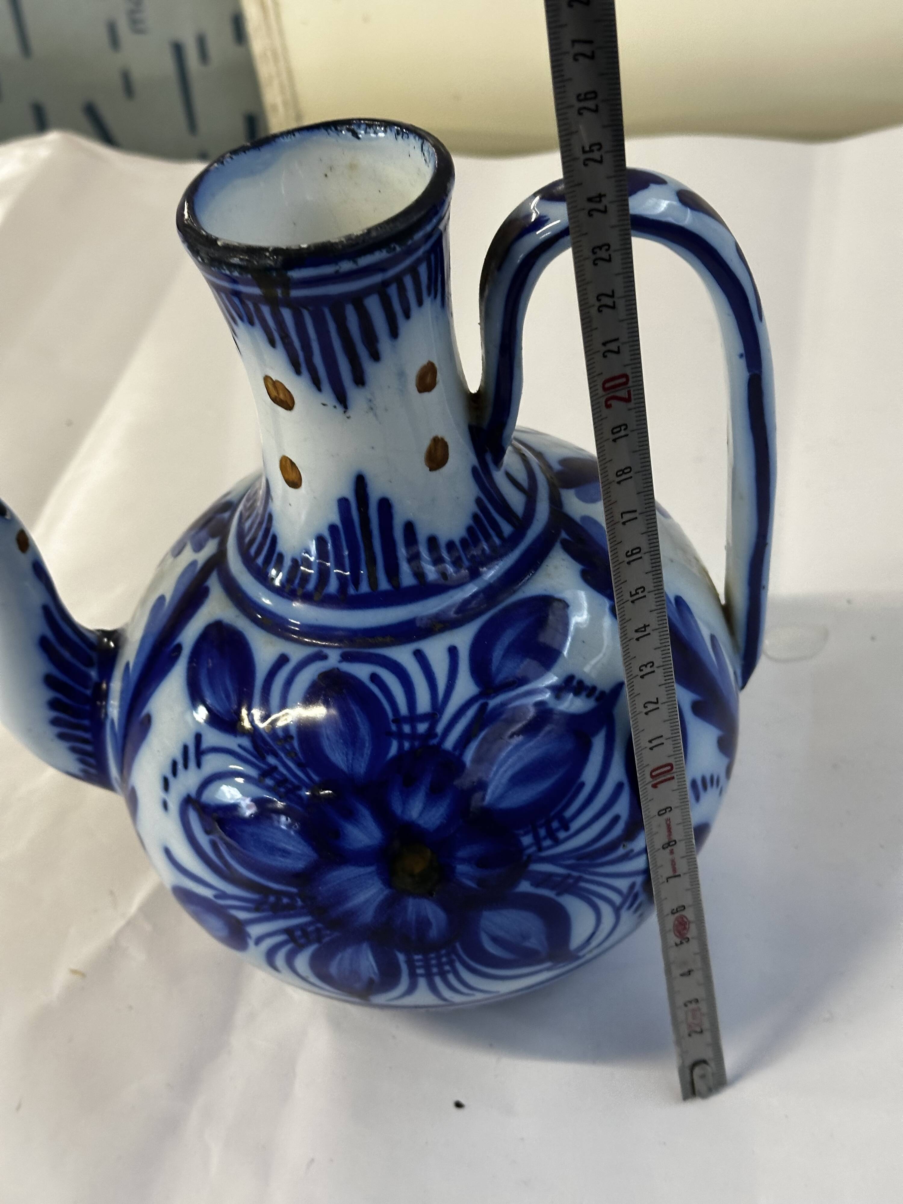 Glazed ceramic carafe with floral decoration