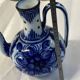 Glazed ceramic carafe with floral decoration
