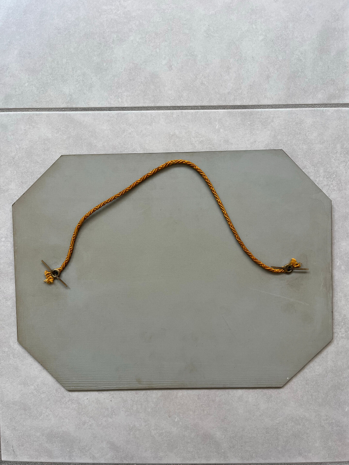 Small bevelled wall mirror from the 1940s.