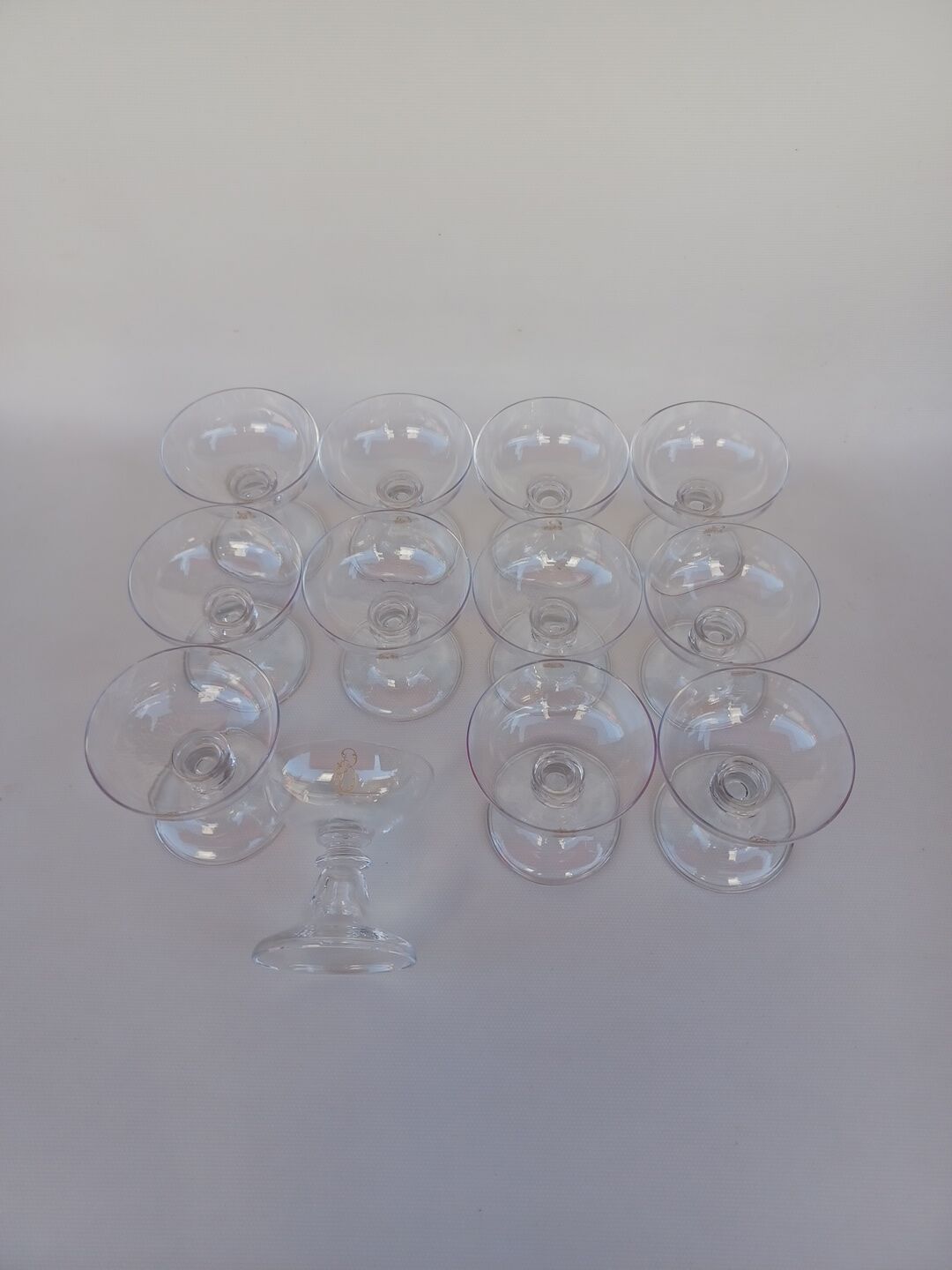 12 Val Saint Lambert crystal champagne glasses. Plain Bell Foot Service. Late 19th century.