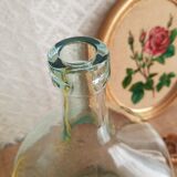 Demijohn in vintage transparent glass