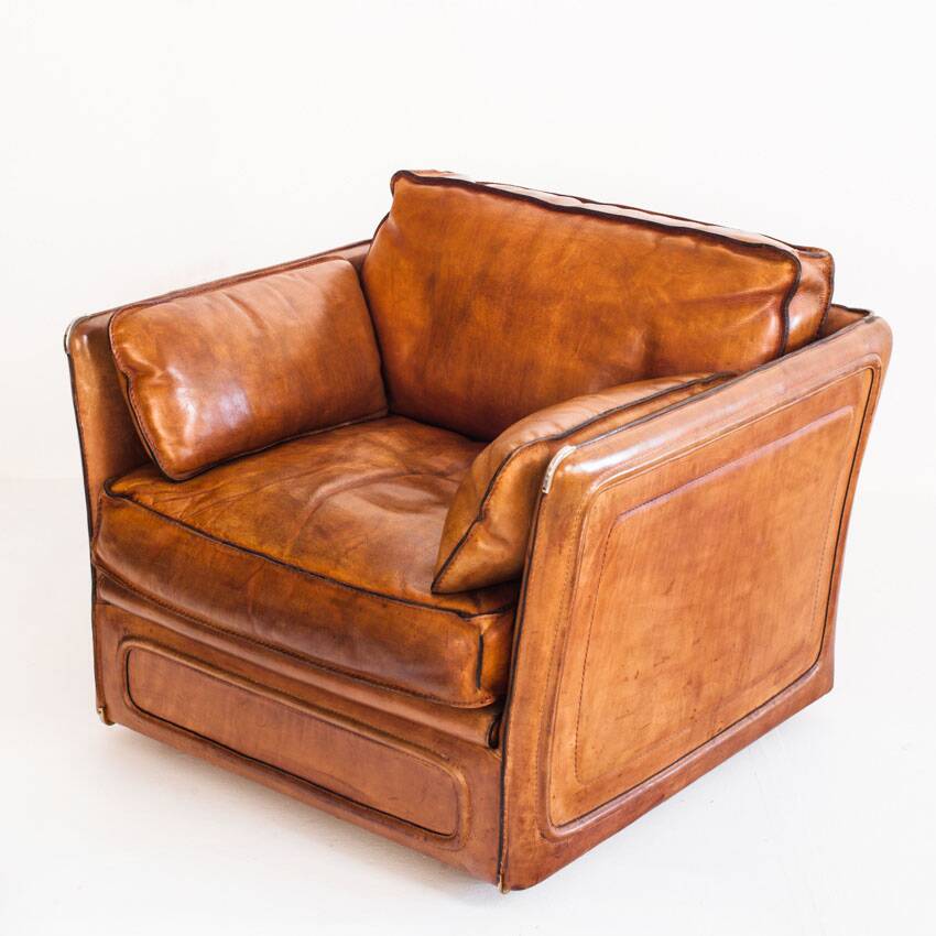 Vintage club armchair by Roche Bobois. Camel buffalo leather. France, 1980s.