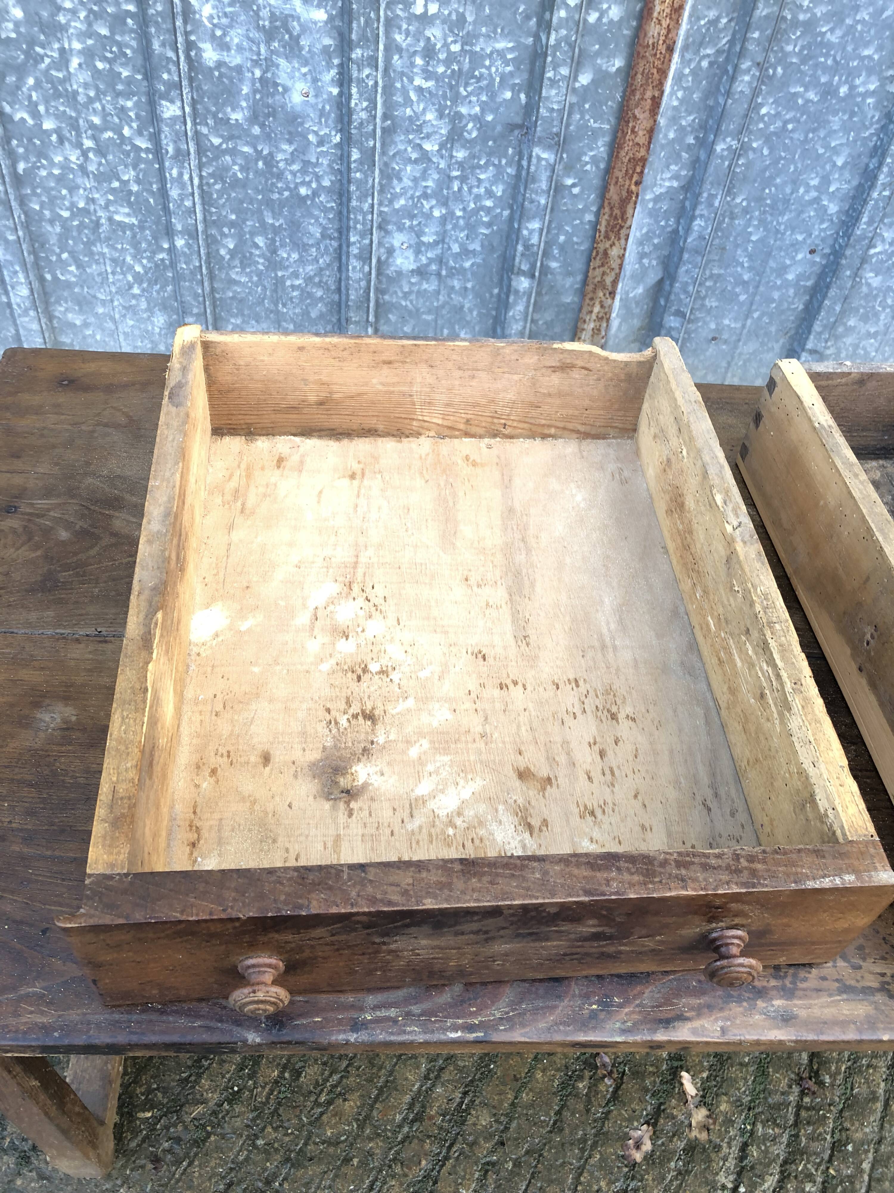 Old chestnut table with 3 front drawers and a cat bar.