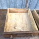 Old chestnut table with 3 front drawers and a cat bar.