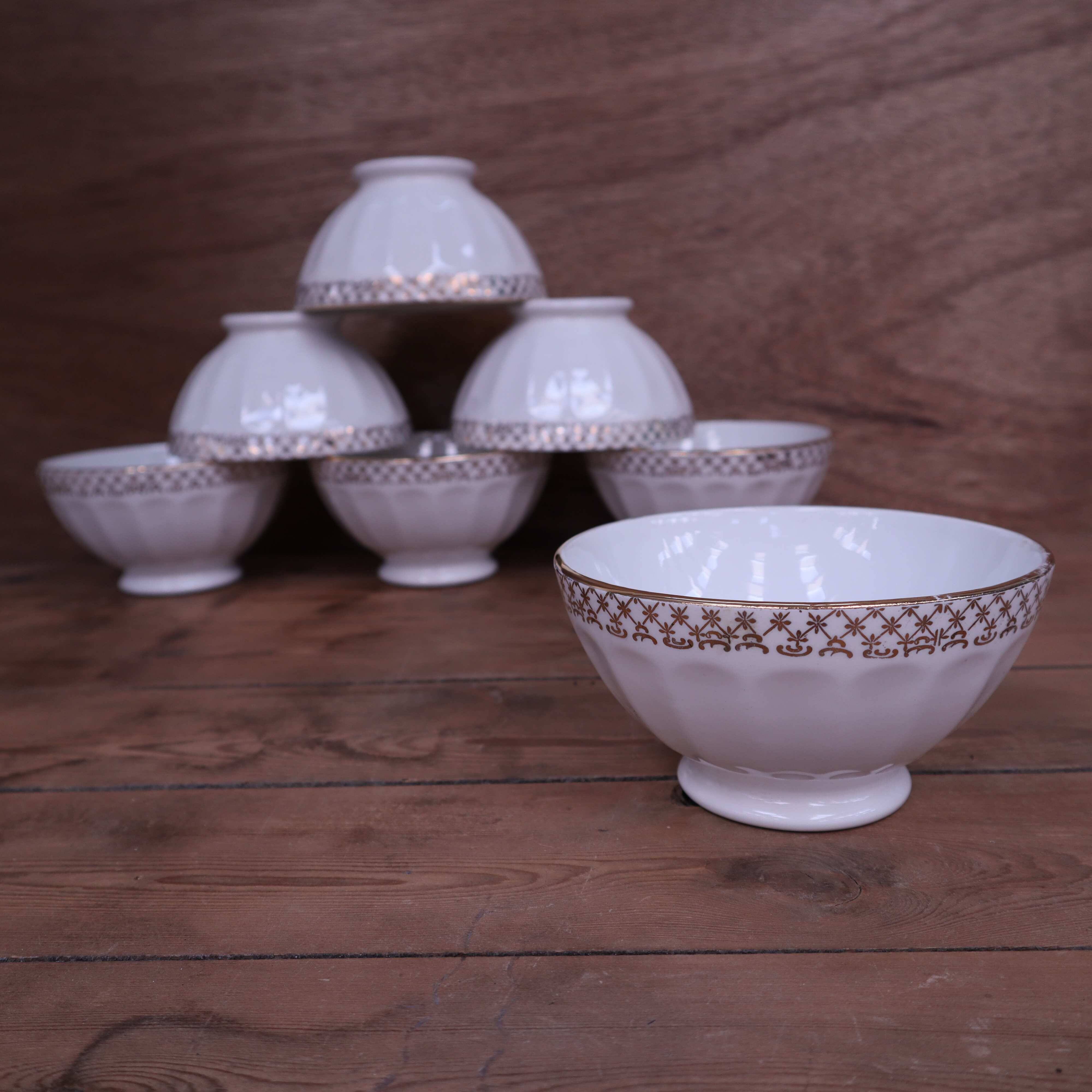 Antique white ribbed porcelain bowl with gold frieze