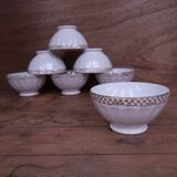 Ancien bol en porcelaine côtelé blanc avec frise dorée