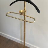 Neoclassical style valet stand in brass and black lacquered wood. French work. Circa 1940