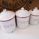 Series of 6 spice pots in white and red enamel for cooking
