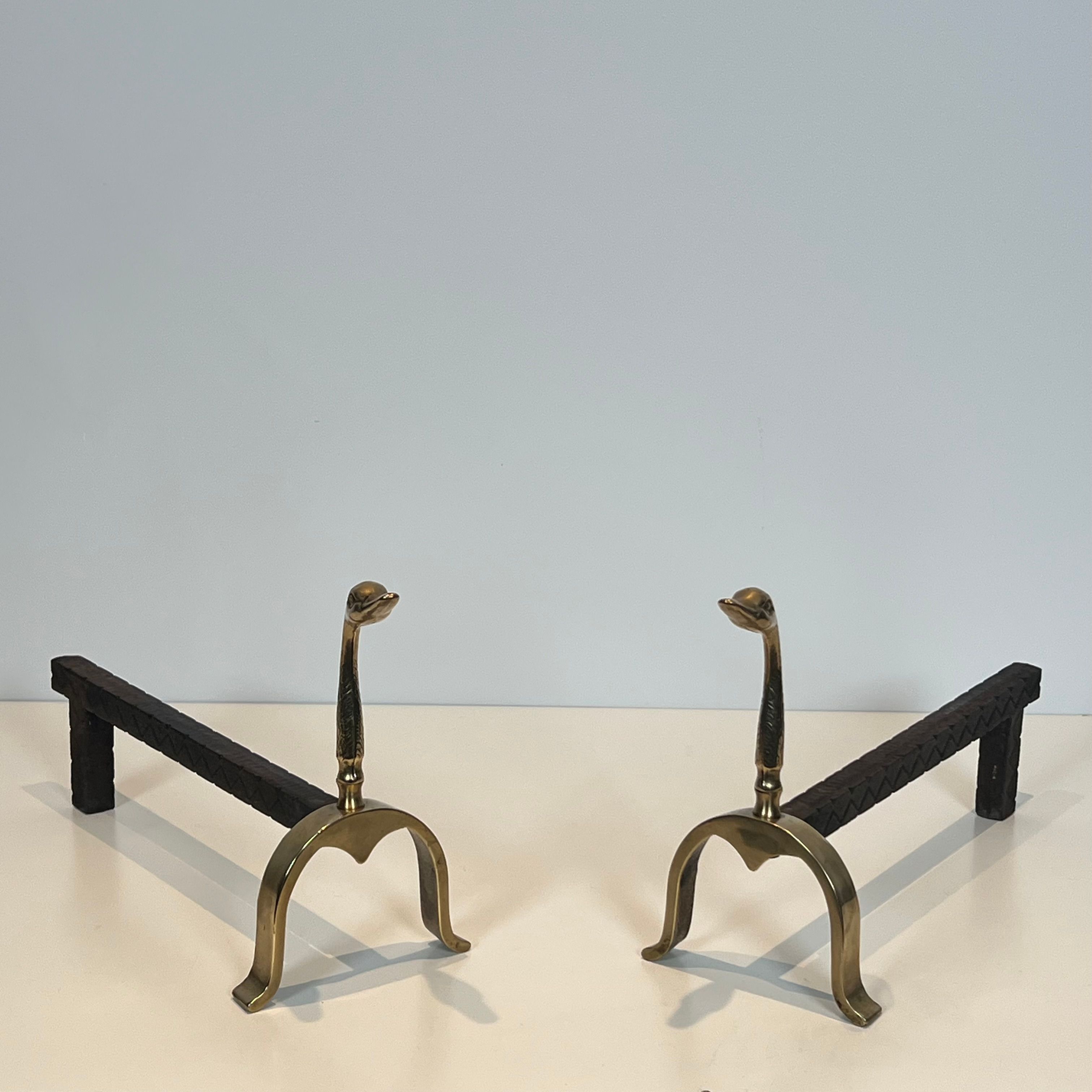 Pair of brass andirons with ducks. In the style of Maison Jansen.