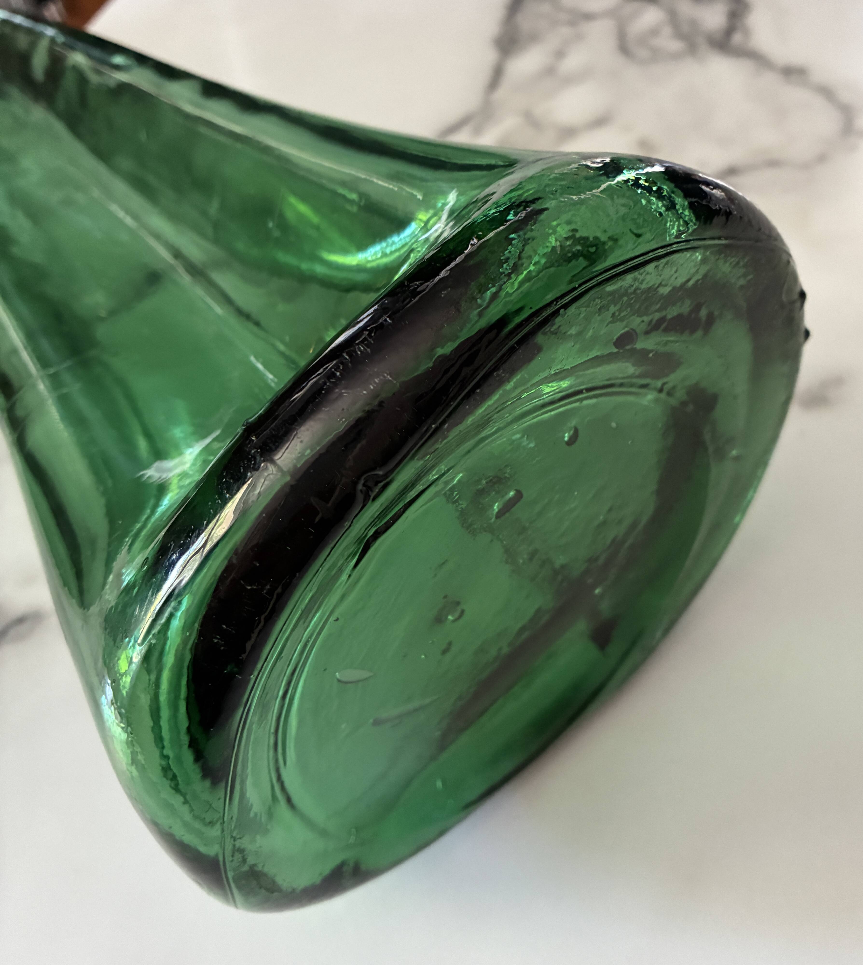 Vintage Viresa bottle in a flattened shape.