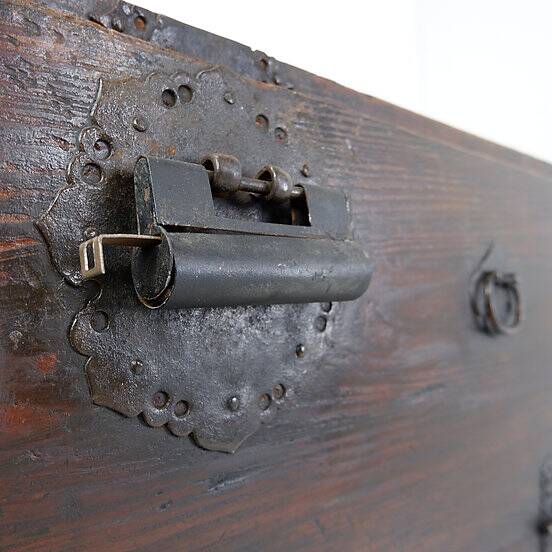 Asian wooden chest with decorative fittings