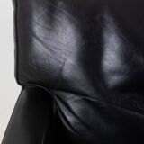 Pair of armchairs in black leather and chrome metal. 1970s.
