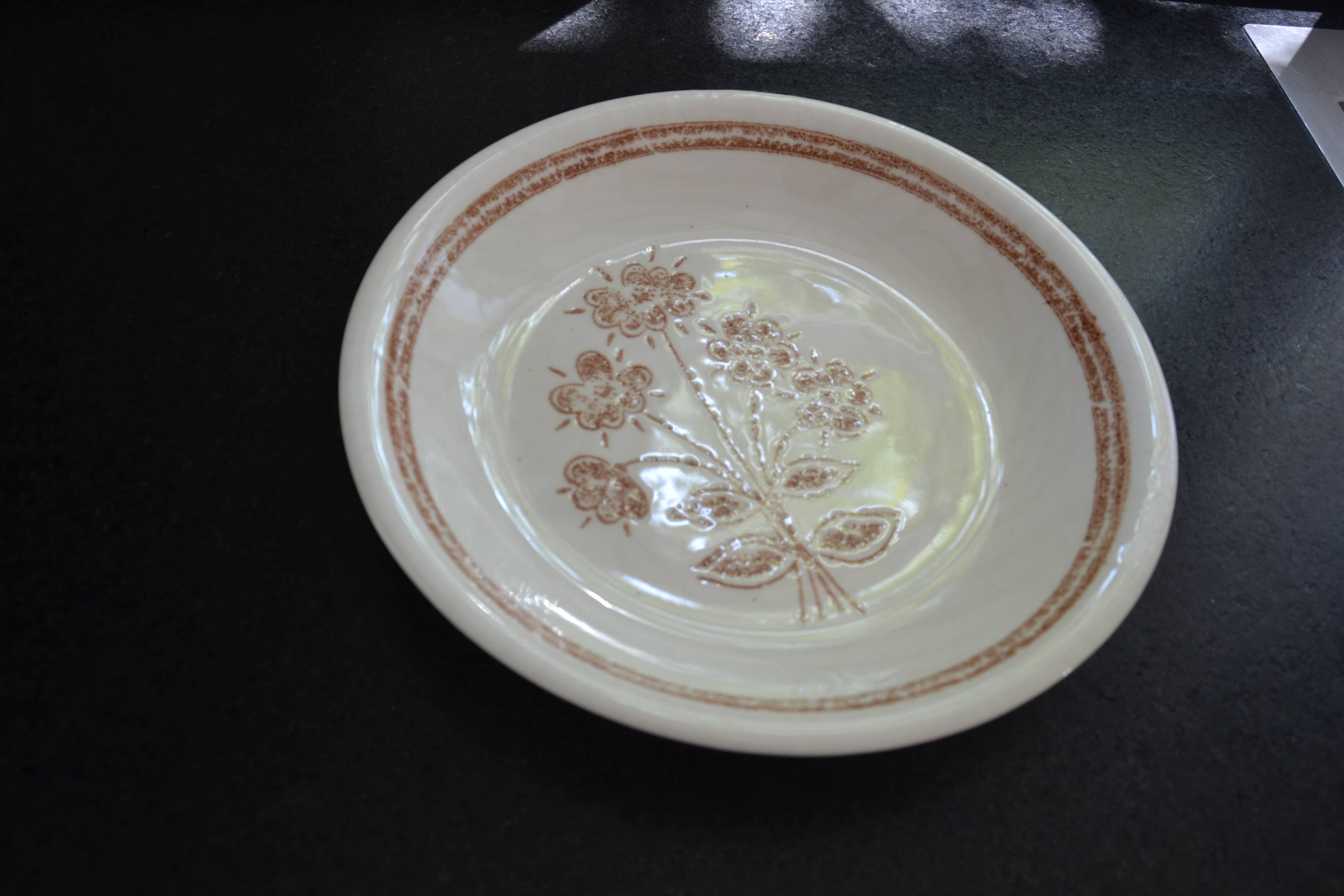 Set of 7 soup plates, dishes and a tureen with flower decoration
