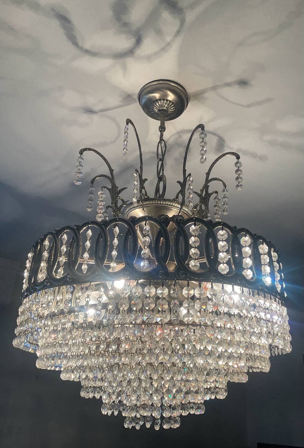 Cascading chandelier with crystal and silvered bronze pendants