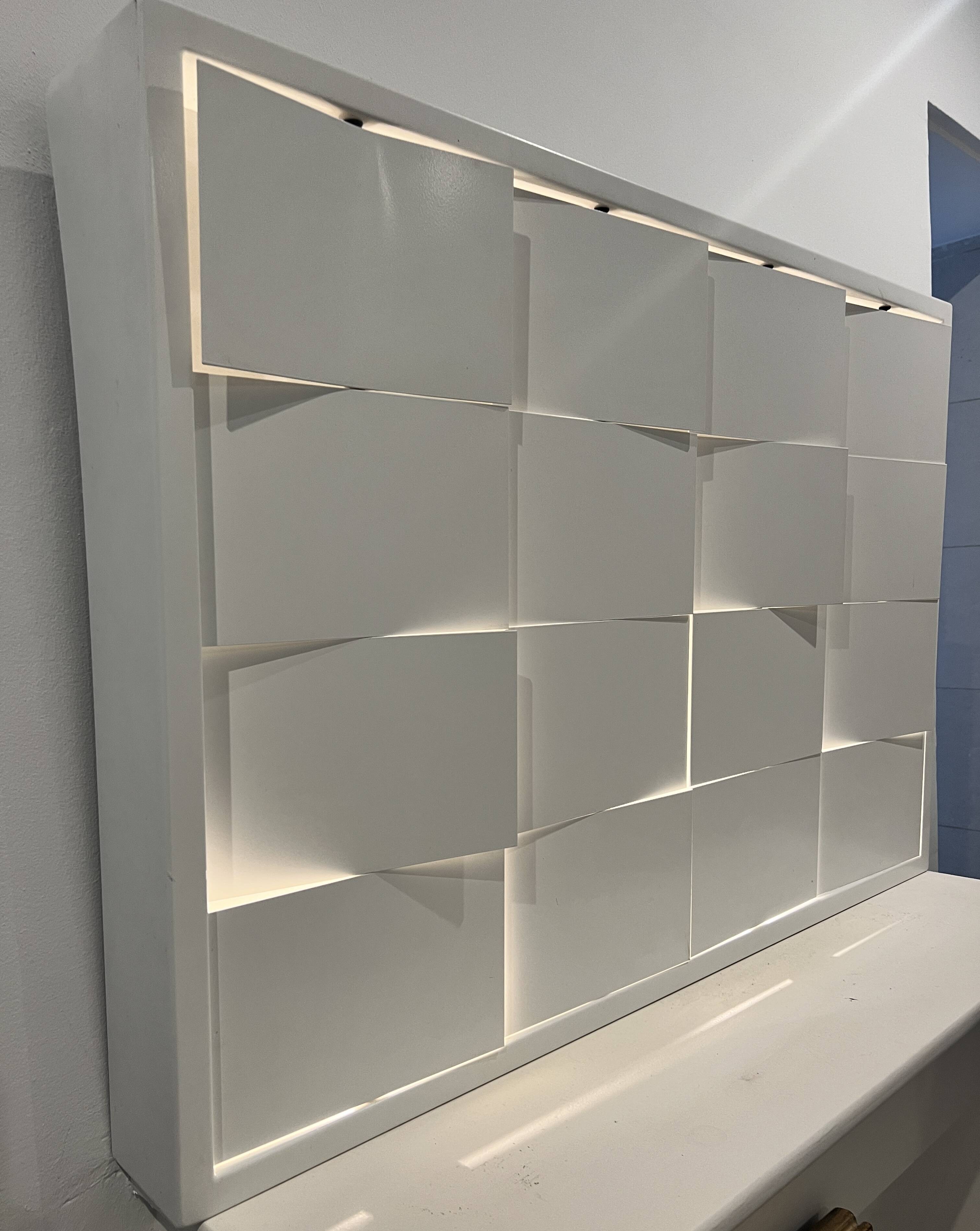 Modernist wall lamp with white metal shade, design by C. Grandidier.