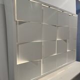 Modernist wall lamp with white metal shade, design by C. Grandidier.