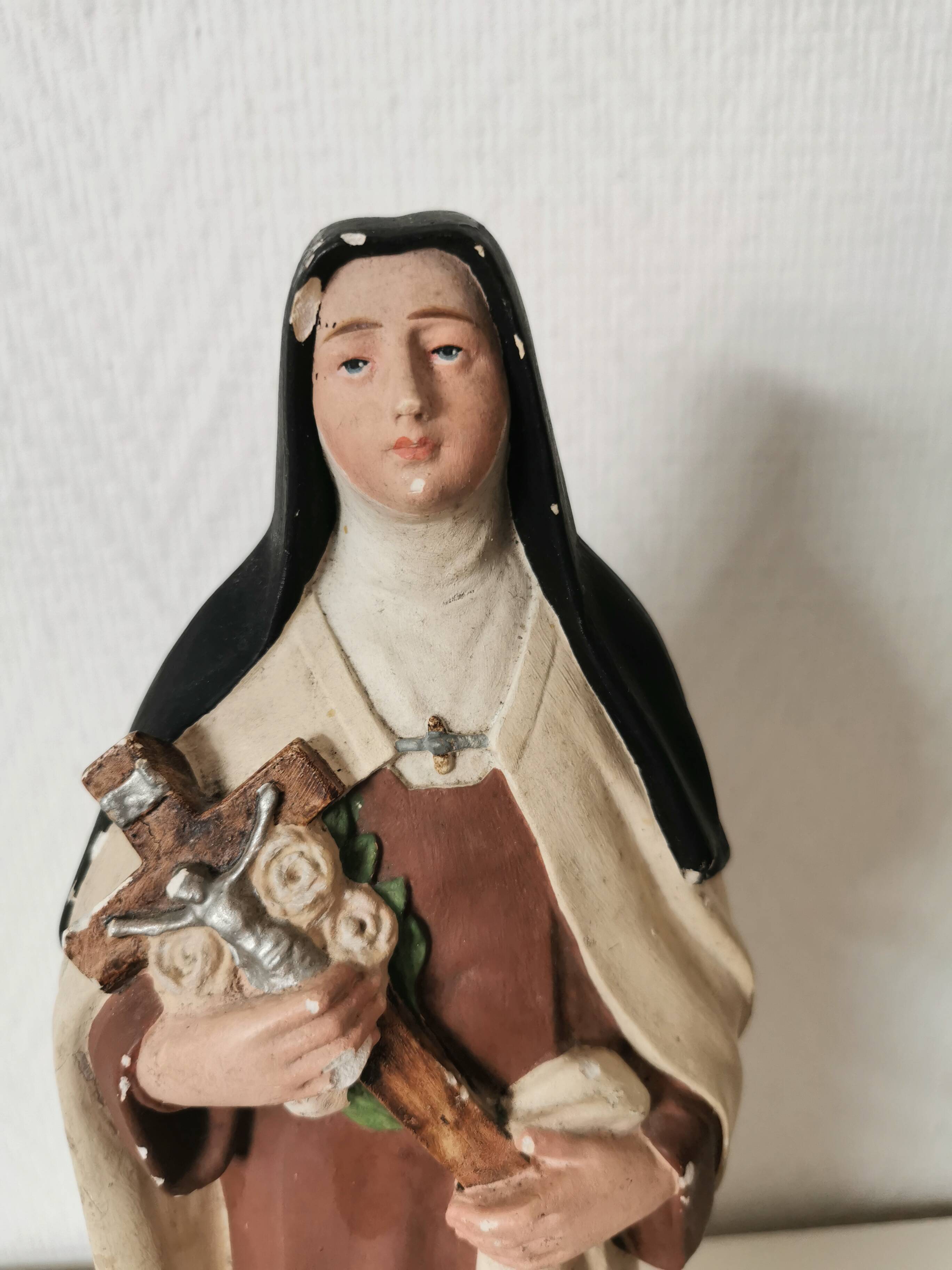 religious statue of Saint Therese of Lisieux in painted plaster