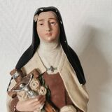 religious statue of Saint Therese of Lisieux in painted plaster