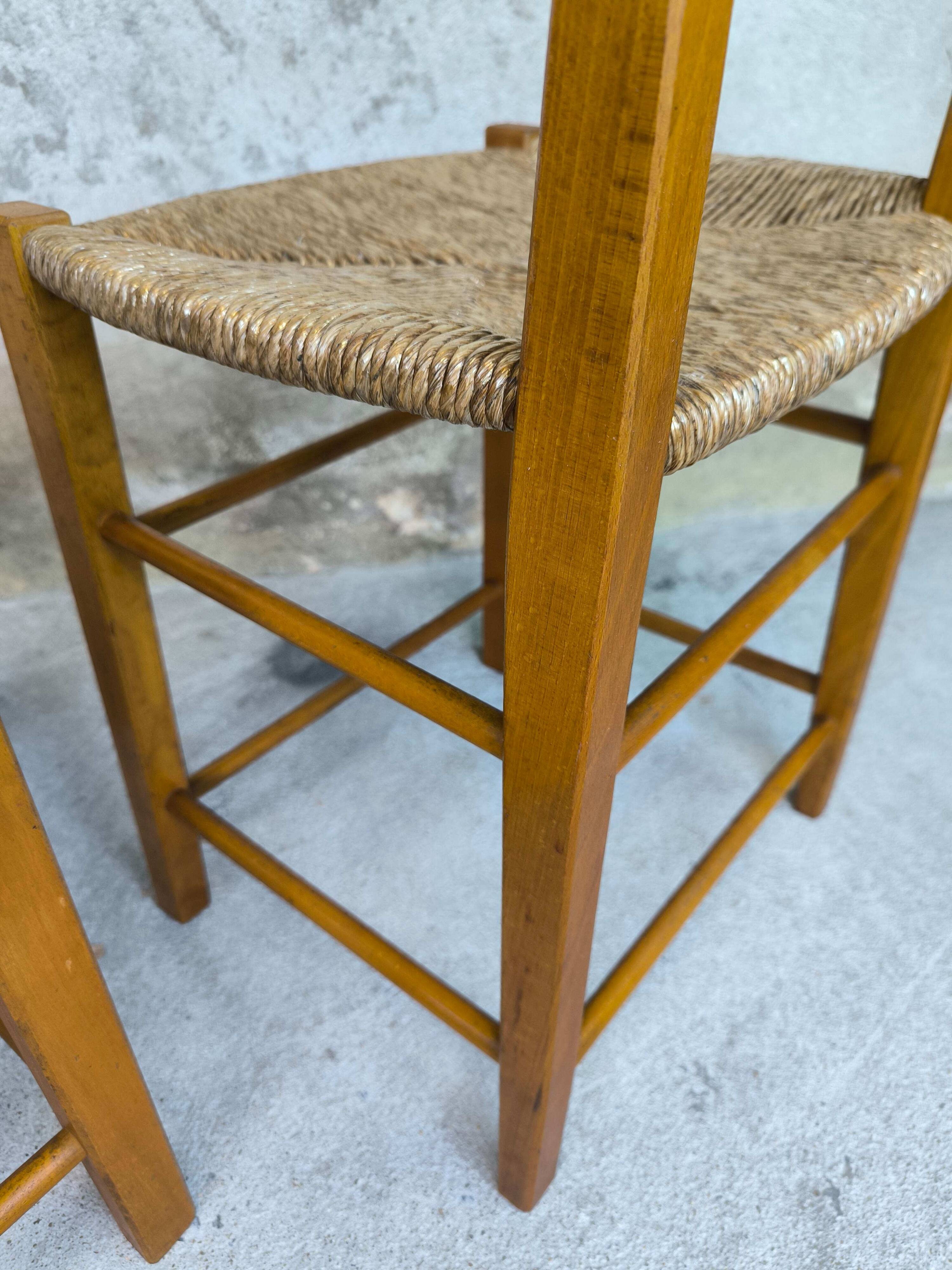 Pair of vintage wood and straw chairs