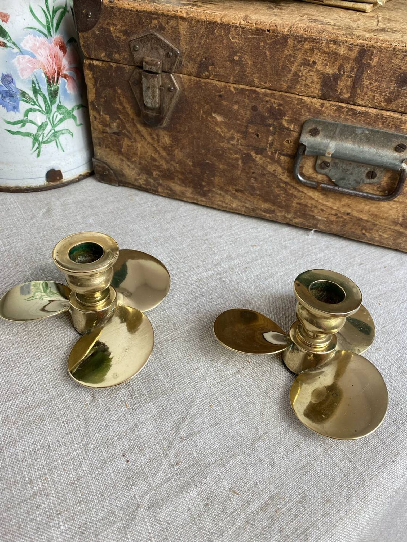 Pair of vintage brass propeller-shaped candlesticks