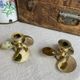 Pair of vintage brass propeller-shaped candlesticks