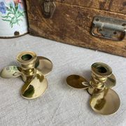 Pair of vintage brass propeller-shaped candlesticks