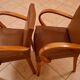 Pair of Art Deco armchairs in curved wood and brown leather – 1930s