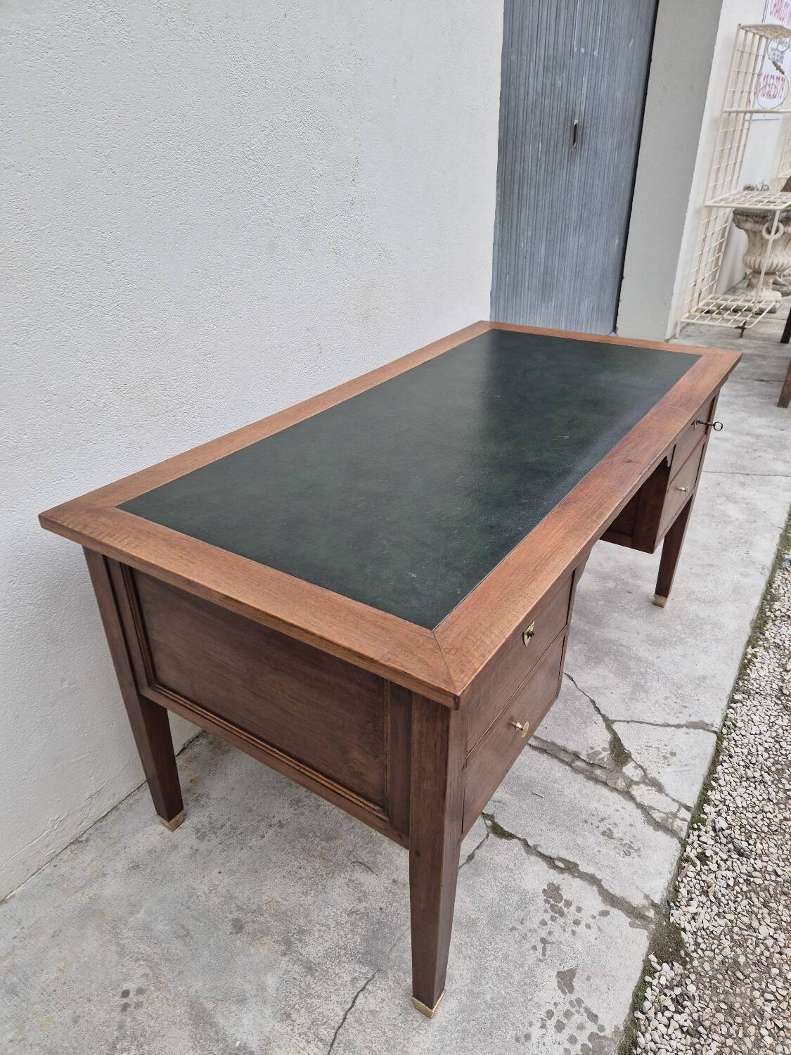 Louis XVI style minister's desk in solid walnut, 4 drawers, old manufacture