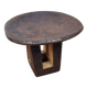 African monoxyle side table in carved wood with a curved top, 48x36 cm.