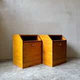 Pair of handcrafted solid wood bedside tables with drop-down doors.