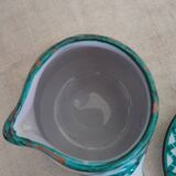 Coffee cup and small milk jug