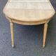 Extendable round table in renovated Louis XVI style, made of light wood, with 2 extensions.
