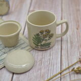 Vintage sandstone tisanière on the theme of chamomile botany