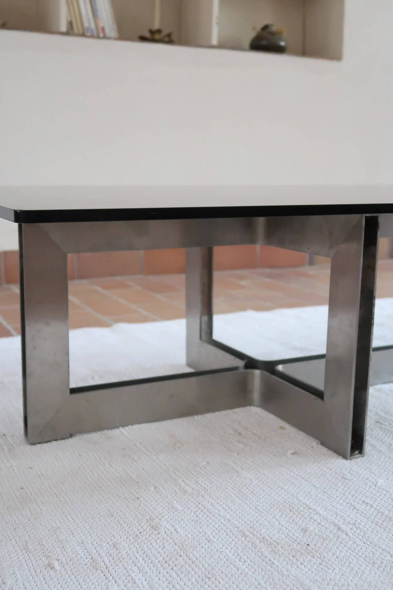 Smoked glass coffee table, brushed stainless steel base, 1970s.