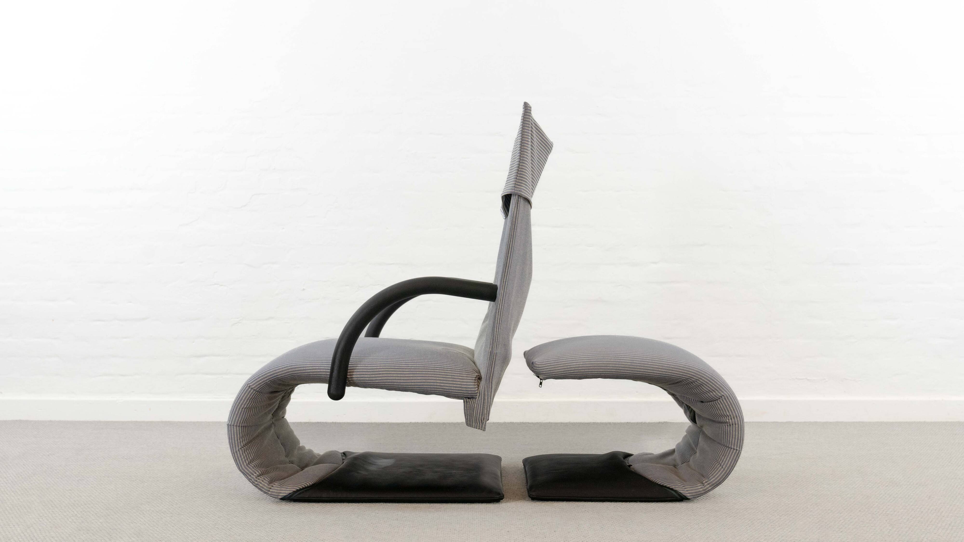Zen easy chair with footrest by claude brisson for ligne roset
