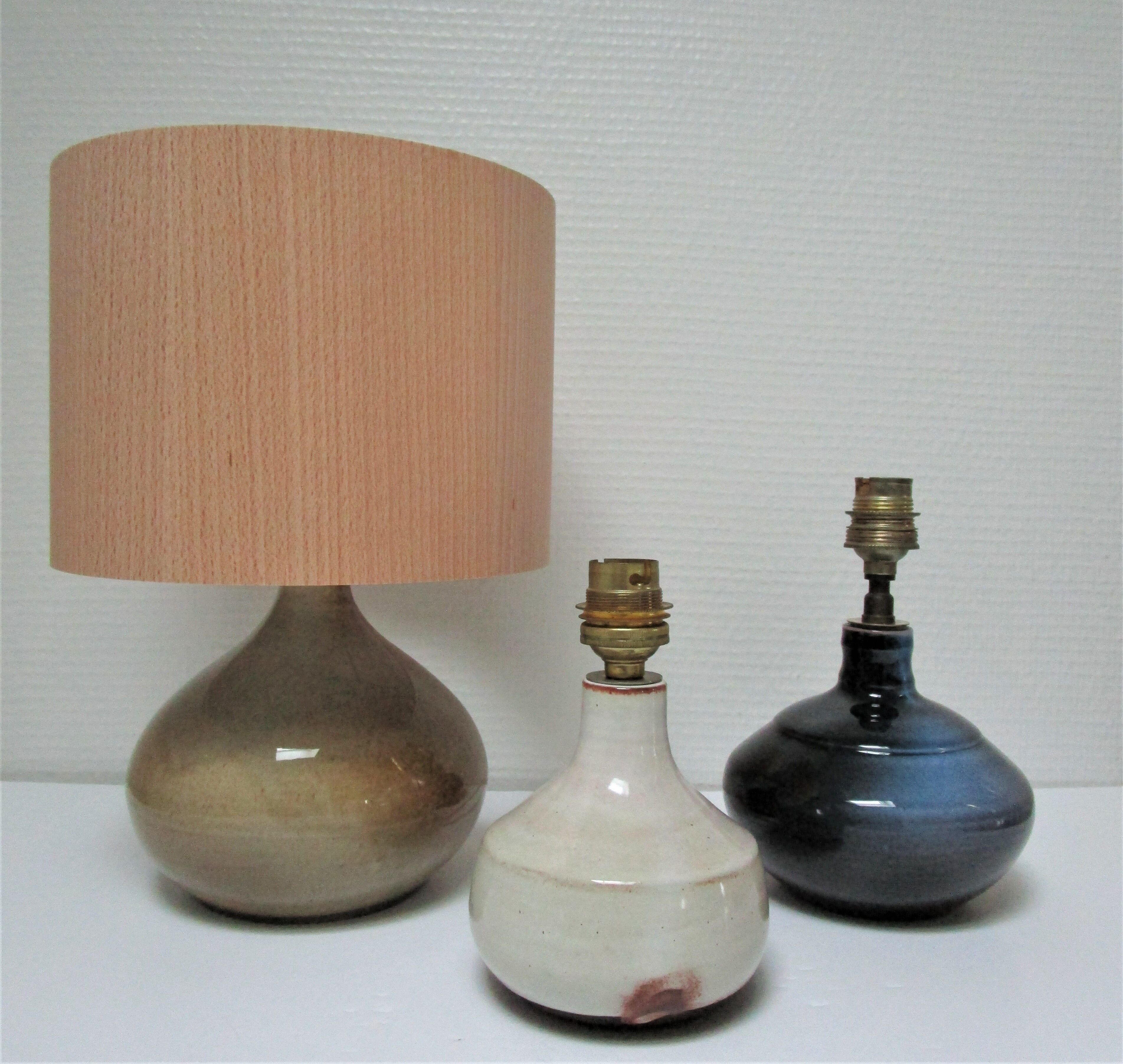 Three vintage ceramic lamps in blue, white and suede