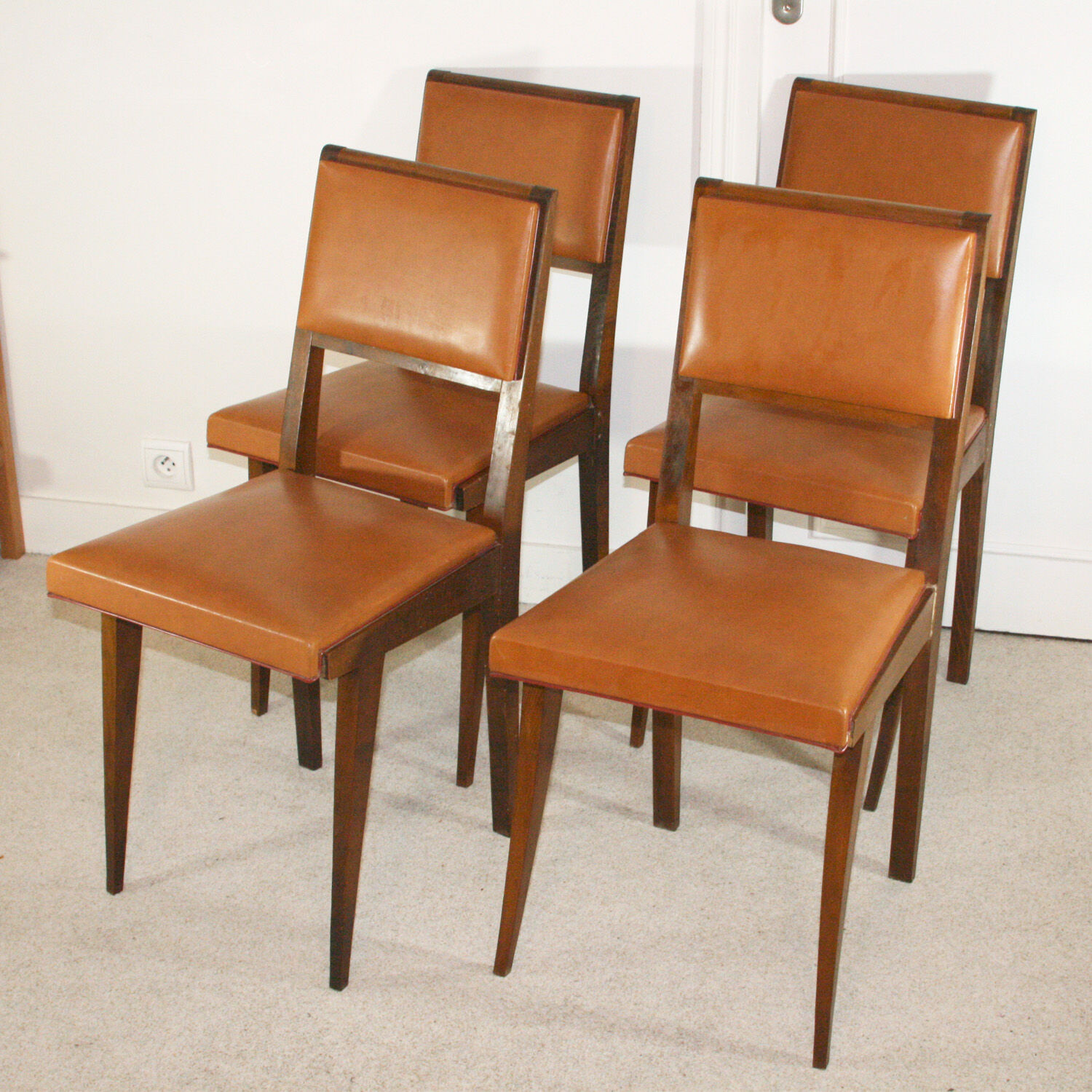 Set of four chairs in wood and leatherette