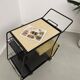 Perforated metal serving trolley in the Mathieu Matégot style