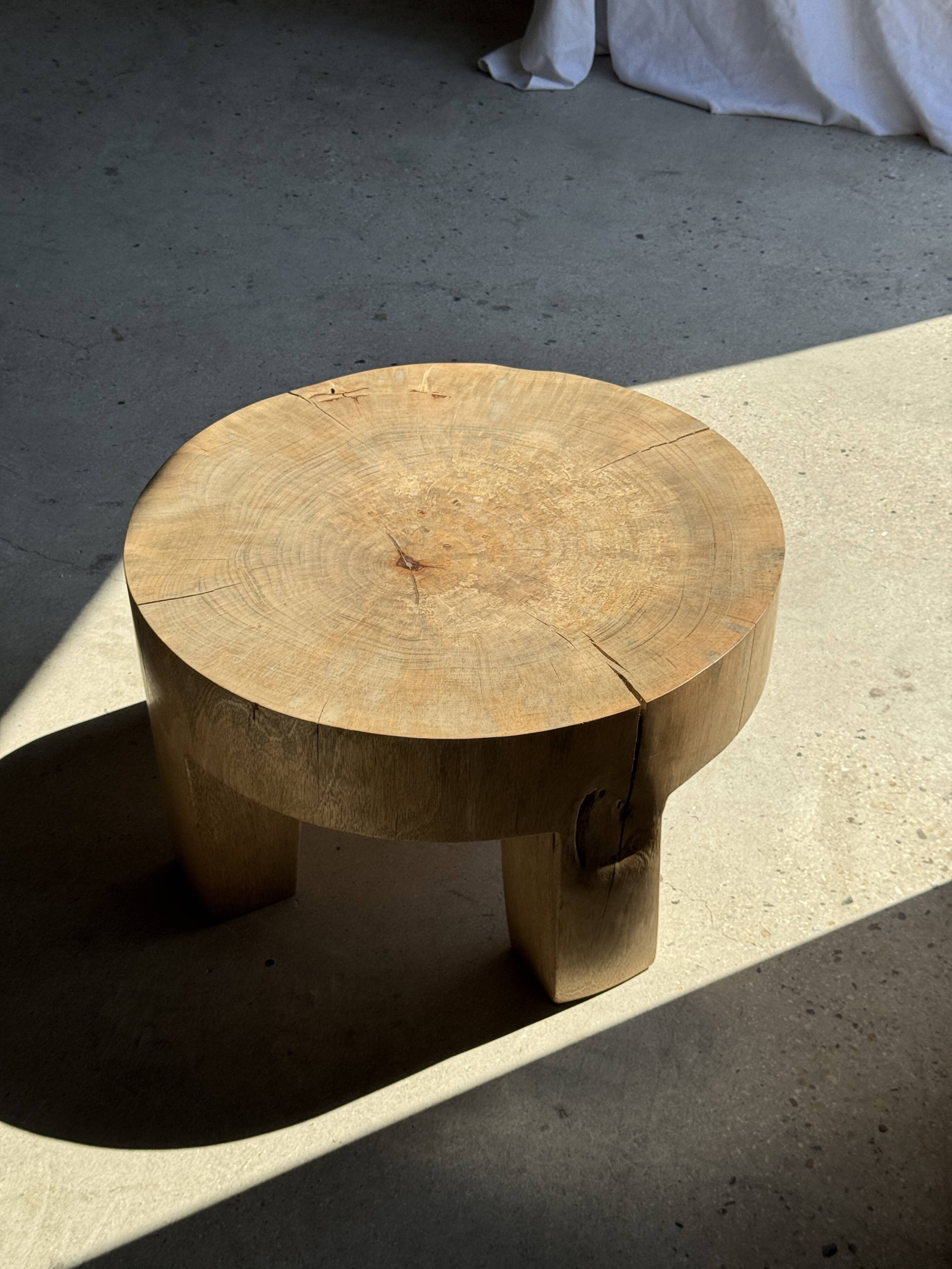 Coffee table, four-legged low table in natural solid monoxyle mango wood.