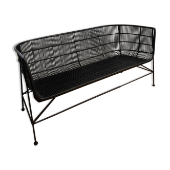 Rattan sofa and black metal