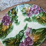 Old barbotine plate with vine motif
