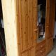 Wardrobe three doors, one with mirror, three drawers in solid pine wood