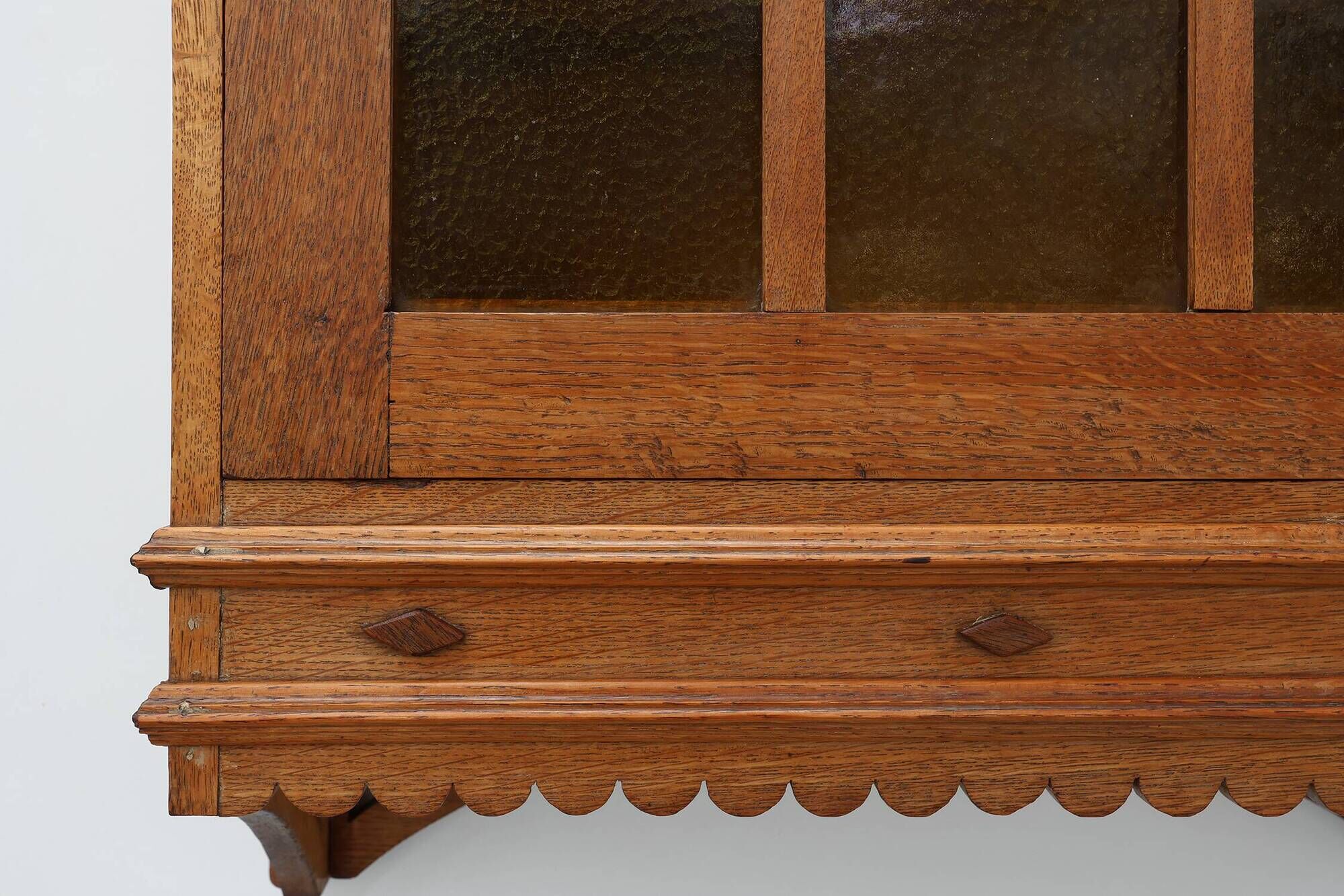 Art Deco oak wall cabinet with amber glazed door, Belgium ca. 1925