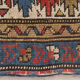 Handwoven blue ground persian rug with bird-like figures