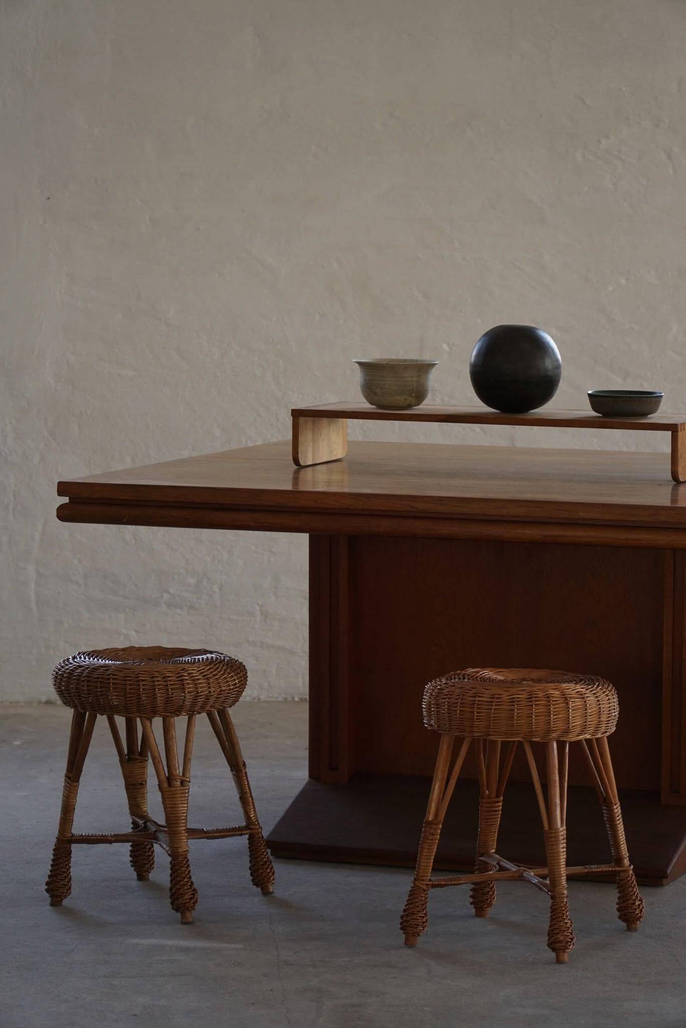 A set of 4 vintage Scandinavian rattan stools, in the style of Tony Paul, from the 1960s.