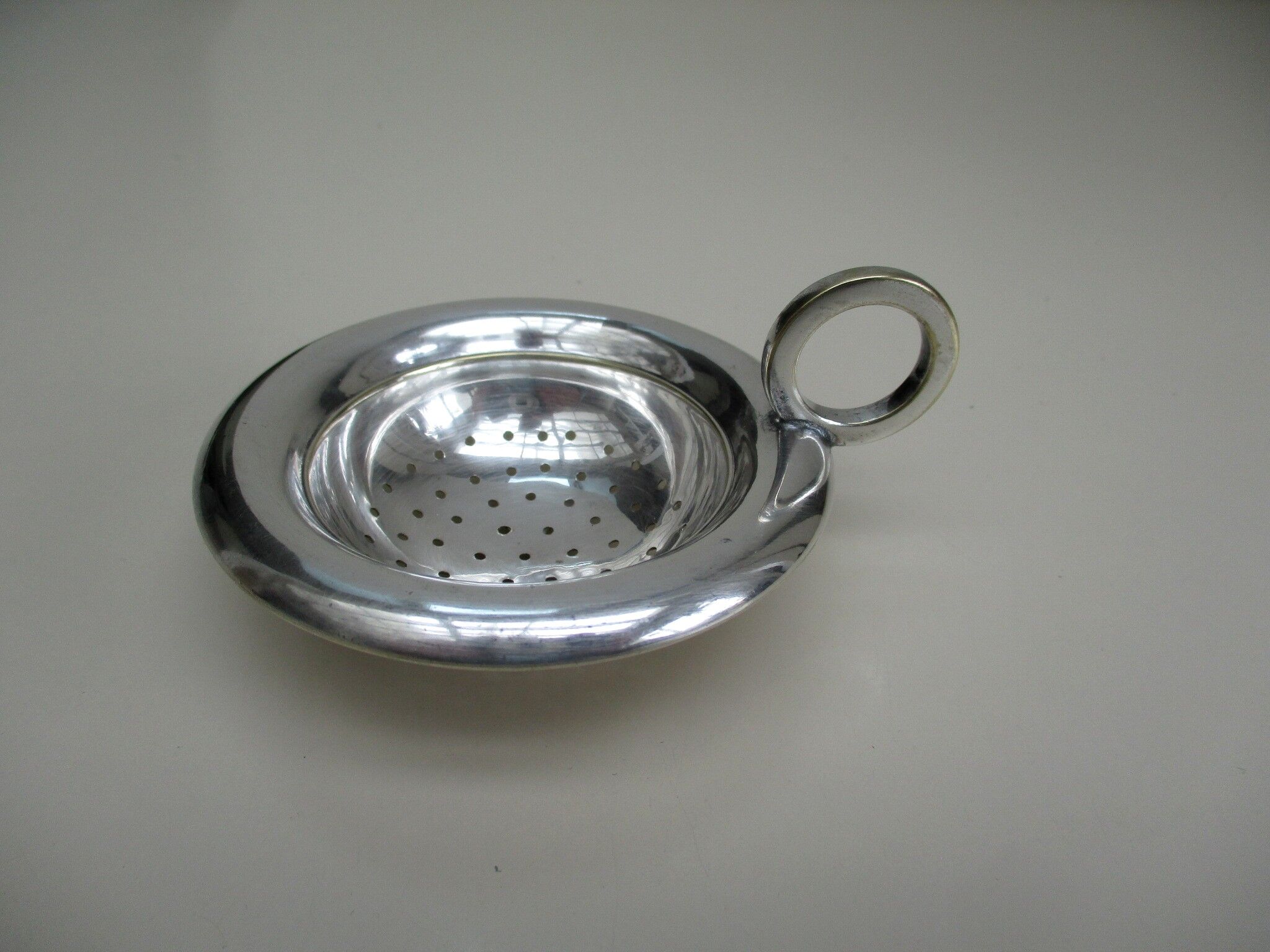 Silver metal tea strainer