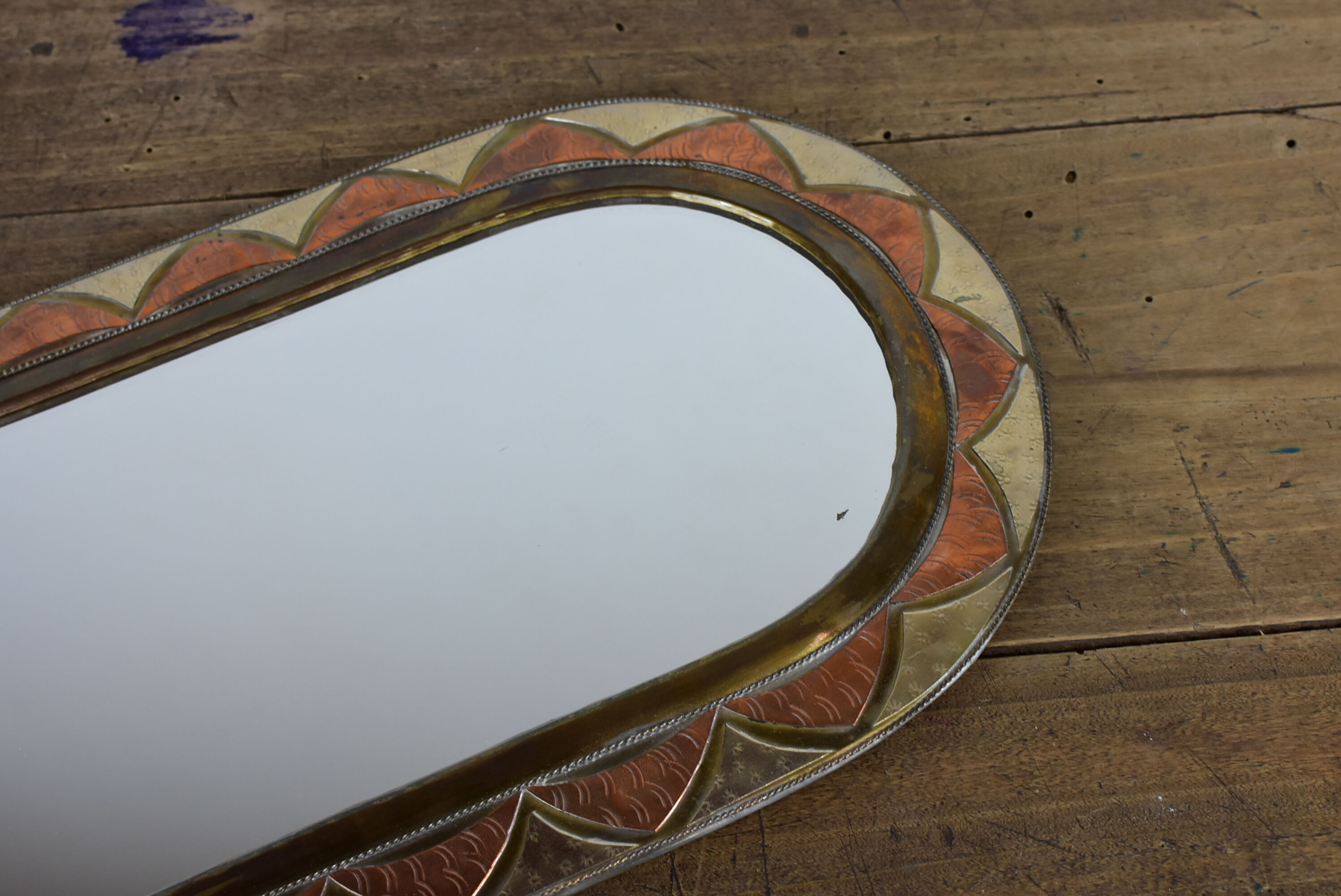 Decorated brass mirror.